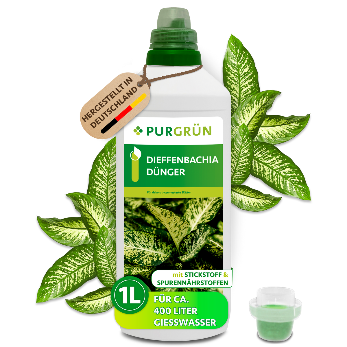 Purgrün Dieffenbachia-Dünger in der 1-Liter-Flasche mit Dosierkappe, umgeben von gemusterten Dieffenbachia-Blättern.