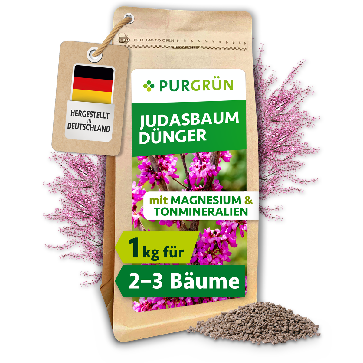 Purgrün Judasbaum-Dünger im 1-kg-Standbeutel mit sichtbarem Granulat und rosafarben blühendem Judasbaum.
