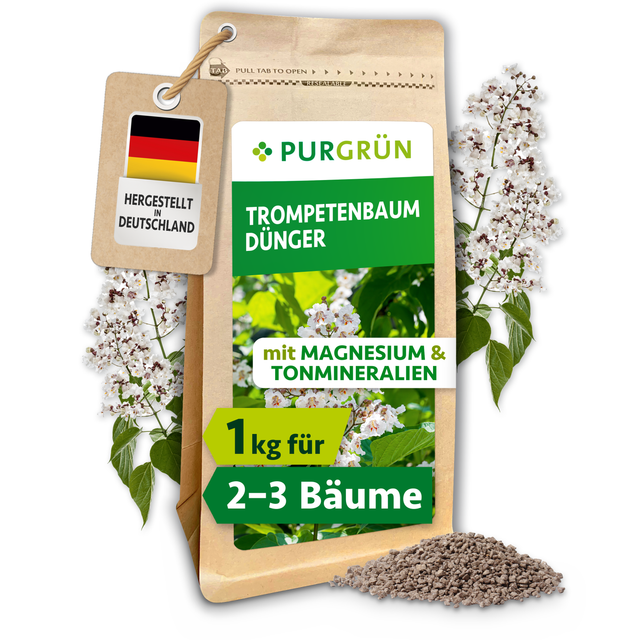 Purgrün Trompetenbaum-Dünger im wiederverschließbaren 1-kg-Beutel, mit Krümelgranulat und weißen Trompetenbaumblüten.